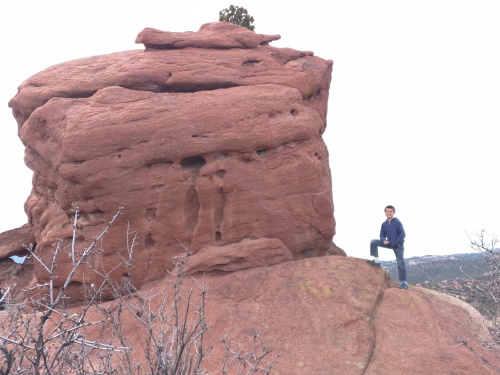 Standing beside red rocks, Garden of the Gods, Colorado