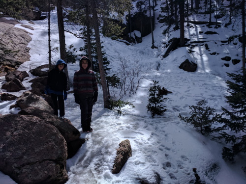 Boys in front of (alleged) Horsethief Falls, near Divide, Colorado