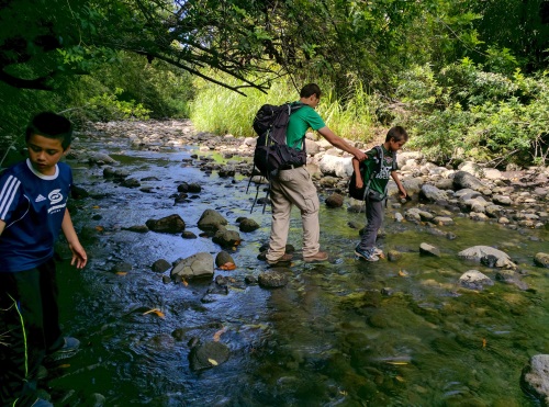 Rock hopping in Honokane Nui Stream towards the Ocean